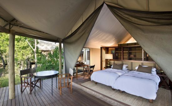 nxabega-okavango-camp-rooms-tented-family-suite-bedroom-01