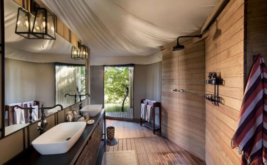 nxabega-okavango-camp-rooms-tented-suite-bathroom-01