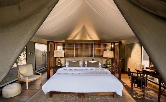 nxabega-okavango-camp-rooms-tented-suite-bedroom-01
